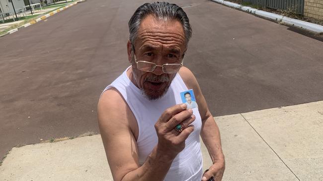 Freed sex predator Aliyawar Yawari outside Perth City Motel with the photo of himself as a younger man. Picture: Paul Garvey