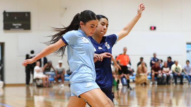 Action between Football NSW Storm and Football NSW Lightning in the U17 girls on day one of the 2025 National Futsal Championships in Melbourne. Picture: Graeme Furlong