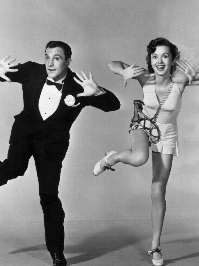 USA dancer actor choreographer Gene Kelly (l) with Debbie Reynolds in scene from film “Singin’ in the Rain”.