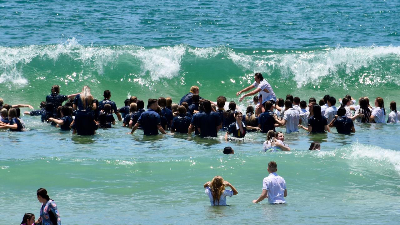 Year 12 graduates from schools across the Sunshine Coast hit to the water at Mooloolaba Beach to celebrate the end of their schooling. Photo: Mark Furler