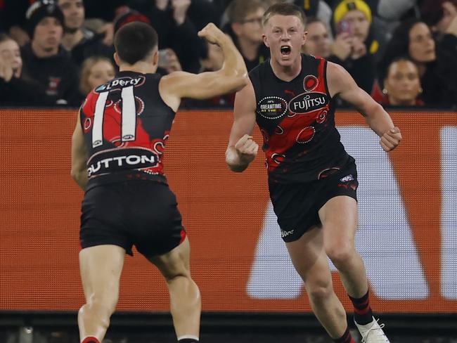 Essendon debutant Angus Clarke (right) celebrates one of his three goals with Jade Gresham during the Bombers’ Dreamtime win over Richmond on Friday night. Picture: Michael Klein