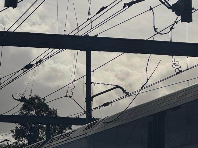 Passengers are stranded on a train with a live overhead wire touching the roof at Strathfield. Picture: Supplied