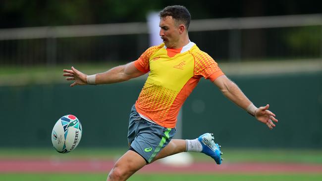 Halfback Nic White practices his kicking. Picture: Getty Images