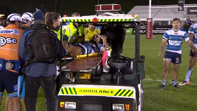 Karl Lawton leaves the field injured.