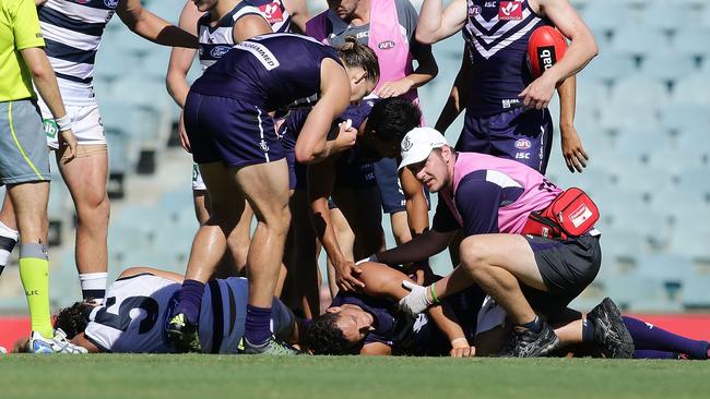 Michael Johnson is assessed after a sling tackle from from Nakia Cockatoo. Picture: Getty Images