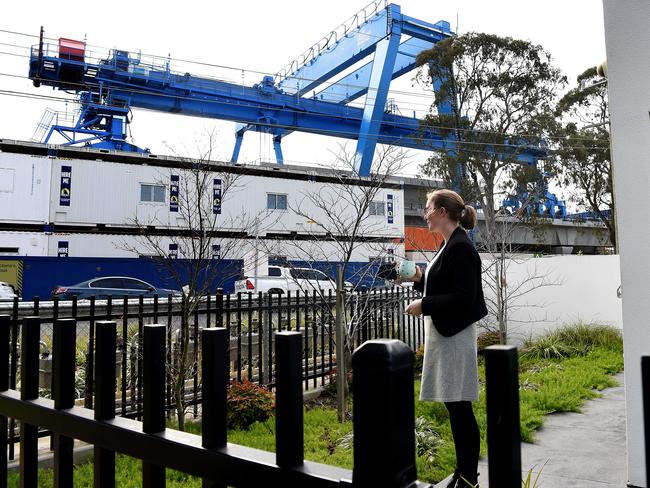 Trixie Gardiner looks towards a massive 60 metre-long wheeled carrier from her backyard. Picture: Nicole Garmston