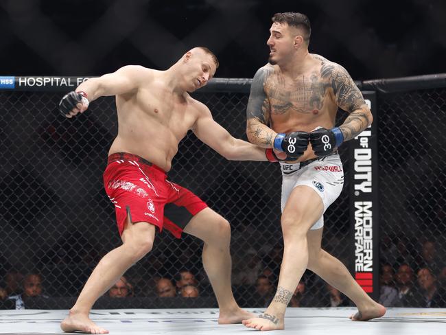 Tom Aspinall knocks out Sergei Pavlovich in the co-main event. Picture: Sarah Stier/Getty Images