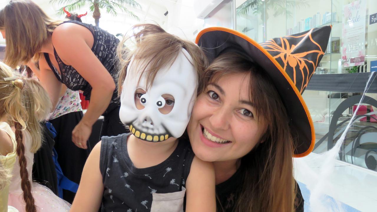 Angelique and River Lee, 4, decorating a trick-or-treat bag.