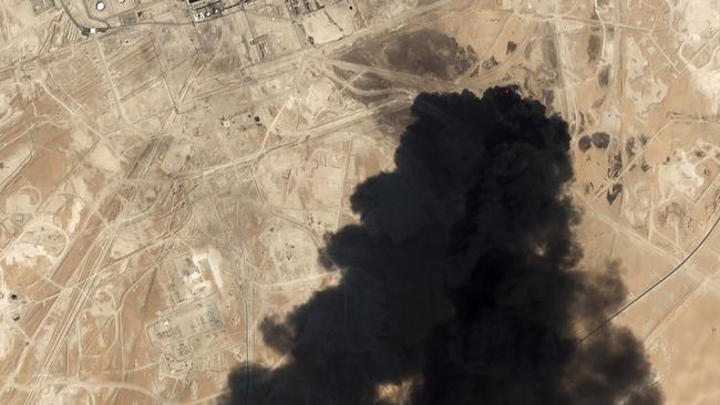 A satellite image shows thick black smoke rising from Saudi Aramco's Abqaiq oil processing facility in Buqyaq, Saudi Arabia. Picture: AP