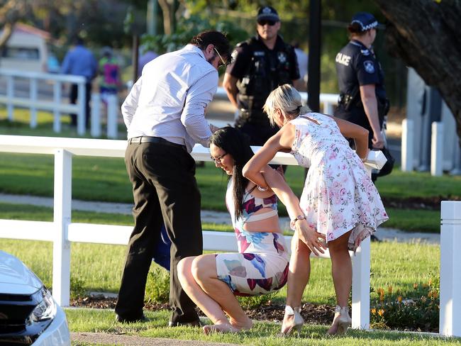 People leaving the Melbourne Cup Day at Eagle Farm. Picture: AAP/Richard Gosling