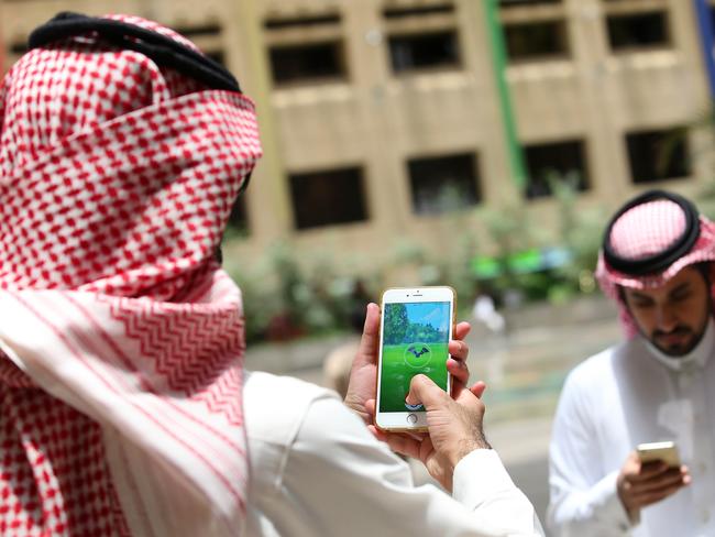 Saudi men play with the Pokemon Go application on their mobiles in the capital Riyadh. Picture: AFP