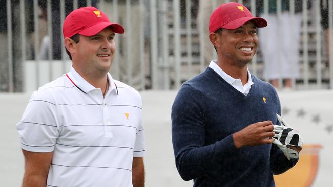 Tigers Woods has a laugh with Patrick Reed. Picture: Michael Klein