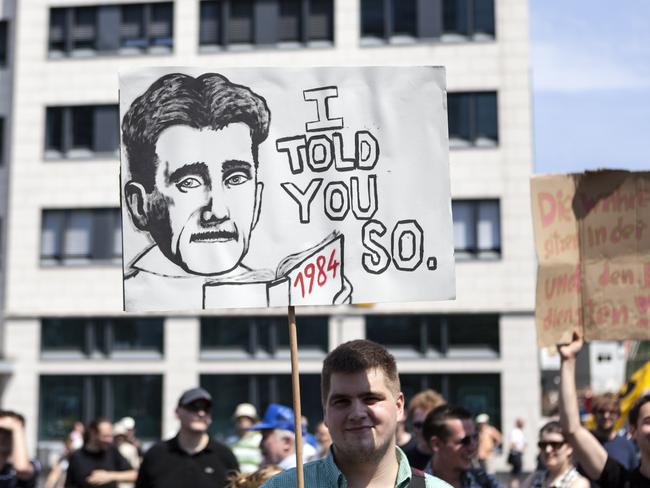 Frankfurt, Germany - July 27, 2013: Protestor holding up a banner during a demonstration in the city center of Frankfurt, Germany. In 30 German cities, a total of more than 10,000 people took to the streets against the excessive surveillance by U.S. intelligence (NSA/Prism).