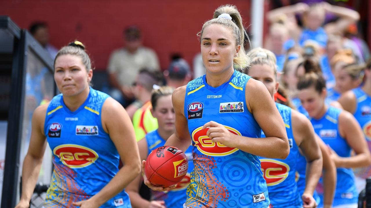 Hannah Dunn leads the Suns out. Picture: AFL Photos