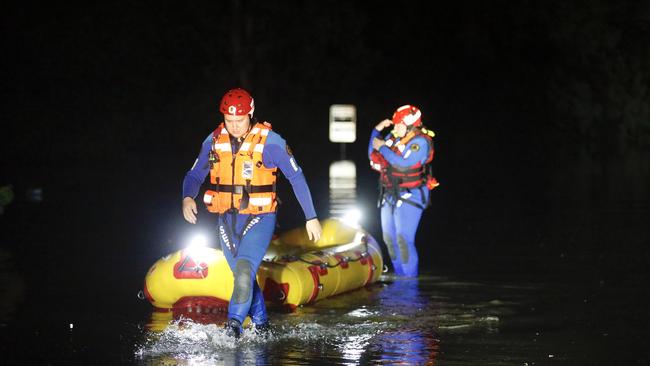 SES flood rescue crew manning a rescue raft on Hollywood Drive, Lansdowne Picture: Steve Tyson