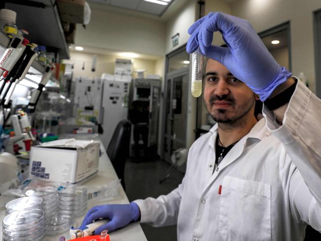 An Israeli scientist works at a laboratory at the MIGAL Research Institute in Kiryat Shmona in the upper Galilee in northern Israel on March 1, 2020 where efforts are underway to produce a vaccine against the COVID-19 coronavirus adapted from another for infectious bronchitis virus. (Photo by JALAA MAREY / AFP)