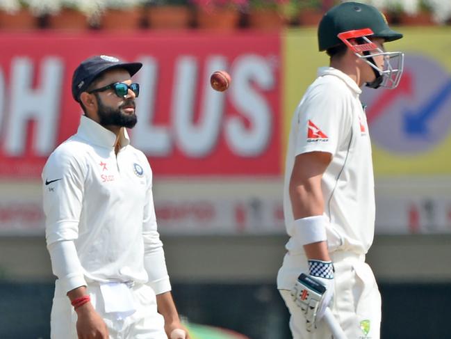 Indian captain Virat Kohli (L) chirps at Australian batsman Matthew Renshaw during a Test in 2017. Picture: AFP PHOTO