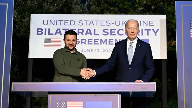 US President Joe Biden and Ukrainian President Volodymyr Zelensky on June 13, 2024 after signing a new pact. (Photo by Mandel NGAN / AFP)