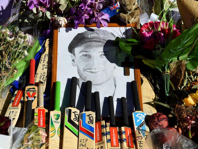 Tributes to the late Phillip Hughes are seen on day 1 of the first Test match between Australia and India at the Adelaide Oval in Adelaide, Tuesday, Dec. 9, 2014. (AAP Image/Dave Hunt) NO ARCHIVING, EDITORIAL USE ONLY, IMAGES TO BE USED FOR NEWS REPORTING PURPOSES ONLY, NO COMMERCIAL USE WHATSOEVER, NO USE IN BOOKS WITHOUT PRIOR WRITTEN CONSENT FROM AAP