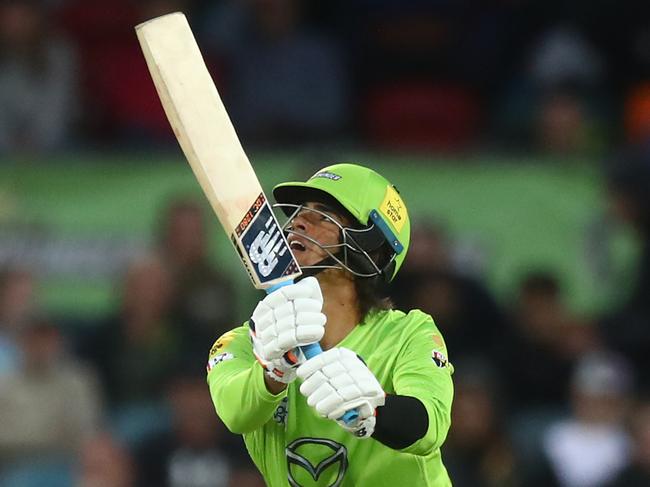 CANBERRA, AUSTRALIA - DECEMBER 29: Ollie Davies of the Thunder hits out during the Big Bash League match between Sydney Thunder and the Melbourne Stars at Manuka Oval, on December 29, 2020, in Canberra, Australia. (Photo by Mike Owen/Getty Images)