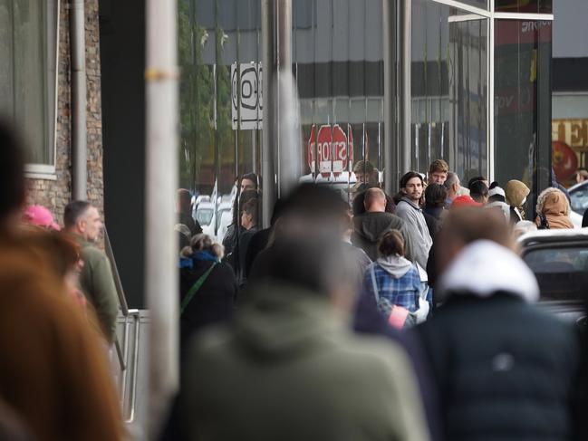 People lined up outside a Centrelink office in Preston, Melbourne. Picture: AAP