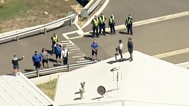 Police negotiate with inmates on the roof. Picture: Sky News