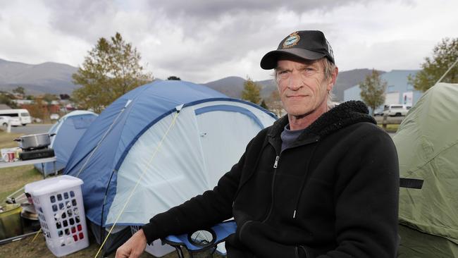 Working dad Garry Evans at the Hobart showground with the tents that he has now been forced to live in with his son, after his landlord allegedly put his rent up from $300 to $400 and then refused to renew his lease. Picture: RICHARD JUPE