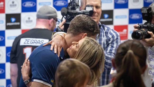 Tom Hawkins embraces wife Emma after the press conference. Picture: Brad Fleet