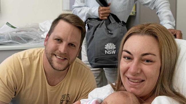 New parents Amanda Crawford and Matthew Laki with their three hour old baby, as member for Clarence Chris Gulaptis delivers them a baby package from the state government. Picture: Adam Hourigan.