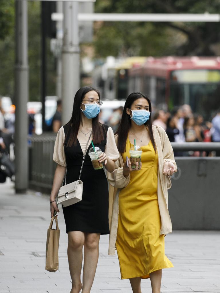 Mask are commonly now being worn around the Sydneys CBD due to the fear of the Coronavirus. Photo: Tim Pascoe