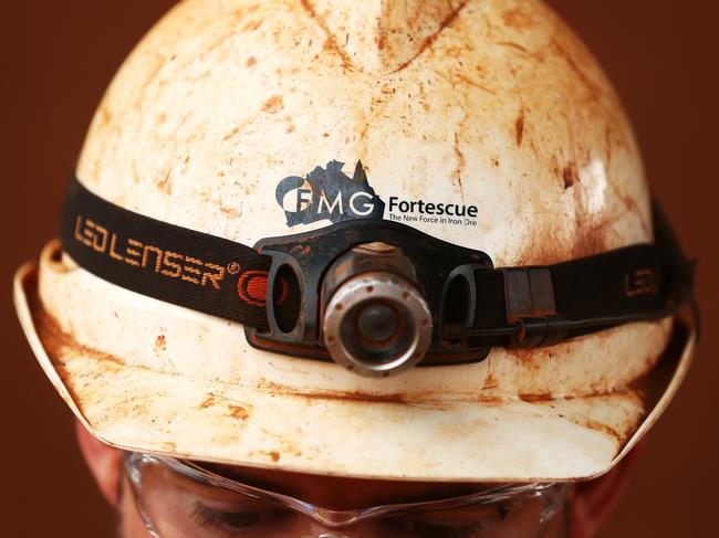 A headlight is worn over a miner's helmet at Fortescue Metals Group Ltd.'s Herb Elliott port facility in Port Hedland, Australia, on Wednesday, Oct. 26, 2016. Shares in Fortescue, the world's No. 4 iron ore exporter, have almost trebled in 2016 as iron ore recovered, and the company cut costs and repaid debt. Photographer: Brendon Thorne/Bloomberg