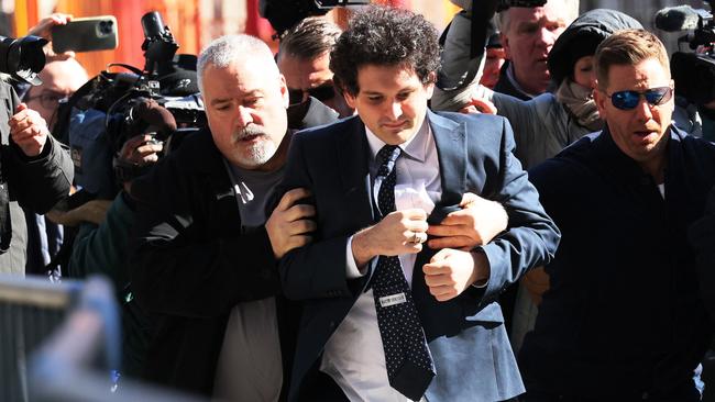 FTX Founder Sam Bankman-Fried arrives at Manhattan Federal Court for a court appearance oin New York City. He is accused of paying a $40 million bribe to one or more Chinese government officials, as well as fraud, conspiracy, and money-laundering offences. Picture: Getty Images