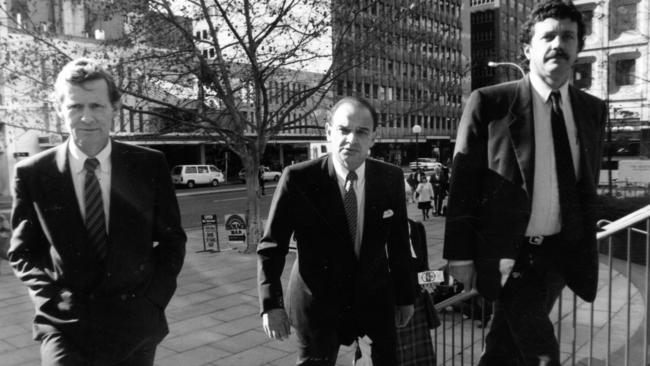 Former State Bank chairman David Simmons, centre, arrives at the State Bank Royal Commission in 1992. Picture: Brenton Edwards