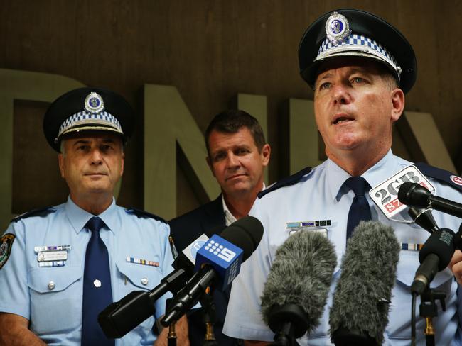 Mr Fuller speaks to the press alongside then-Premier Mike Baird and Acting Deputy Commissioner Frank Mennilli ahead of New Years Eve celebrations. Picture: Toby Zerna