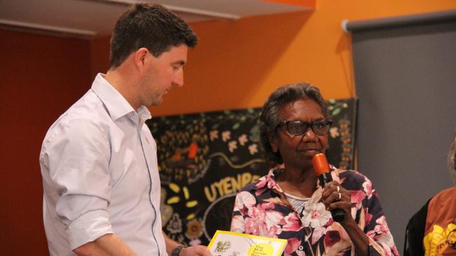 CLP Braitling MLA Josh Burgoyne receives the MK Turner report from Shirley Turner at the Desert Knowledge Precinct, Alice Springs, Friday, August 30. Picture: Gera Kazakov