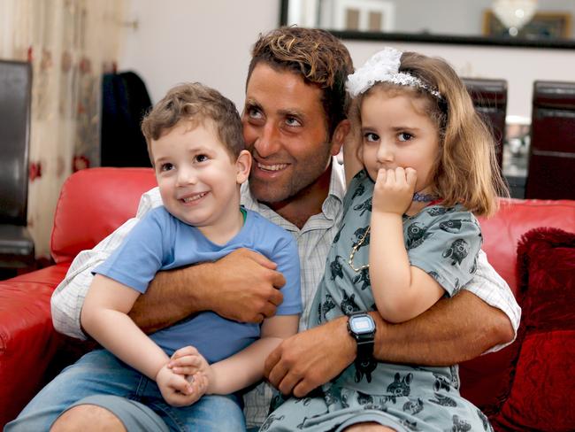 Ali Elamine poses with his children Noah and Lahela, who are at the centre of the kidnapping scandal. Picture: Reuters/Mohamed Azakir.