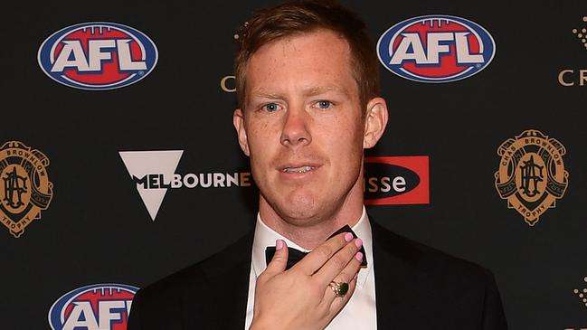 Jack Riewoldt has his tie adjusted as he poses for a photograph on the red carpet