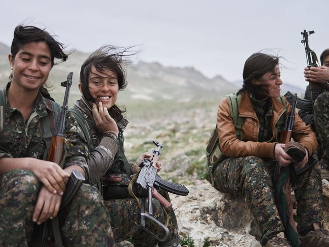 Women of the Shingal Resistance Unit rest on Sinjar on Mountain, Iraq