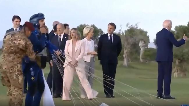 US President Joe Biden, appears to wander off during a paratrooper display in Italy for the G7 summit. Source - Twitter