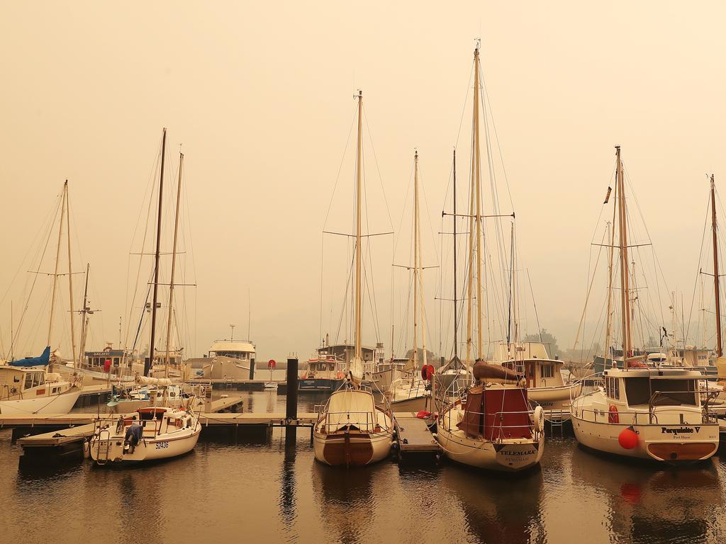 January 2019 Tasmanian Bushfires. Yachts at Port Huon marina in thick smoke. Picture: NIKKI DAVIS-JONES