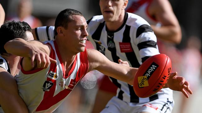 Olinda Ferny Creek’s Nicholas Keegan is caught during Saturday’s clash with Narre Warren   Picture: Andy Brownbill