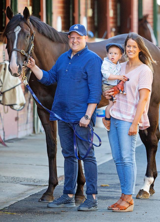 Jonathon Monasso meets racehorse Grunt, alongside wife Julia and their one-year-old son, Bruno. Picture: Mark Stewart