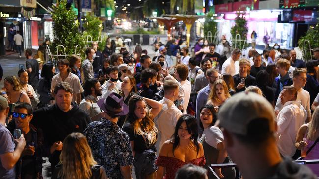 Revellers without masks on Acland St in St Kilda. Picture: Josie Hayden