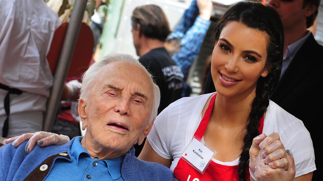 Douglas and media personality Kim Kardashian attend a Thanksgiving event to feed the homeless at the Los Angeles Mission in 2011. Picture: AFP