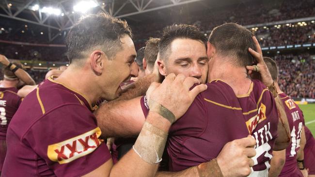 BRISBANE, AUSTRALIA - JULY 12: Billy Slater, Cooper Cronk and Cameron Smith of the Maroons celebrate victory after game three of the State of Origin series between the Queensland Maroons and the New South Wales Blues at Suncorp Stadium on July 12, 2017 in Brisbane, Australia. (Photo by Mark Kolbe/Getty Images)