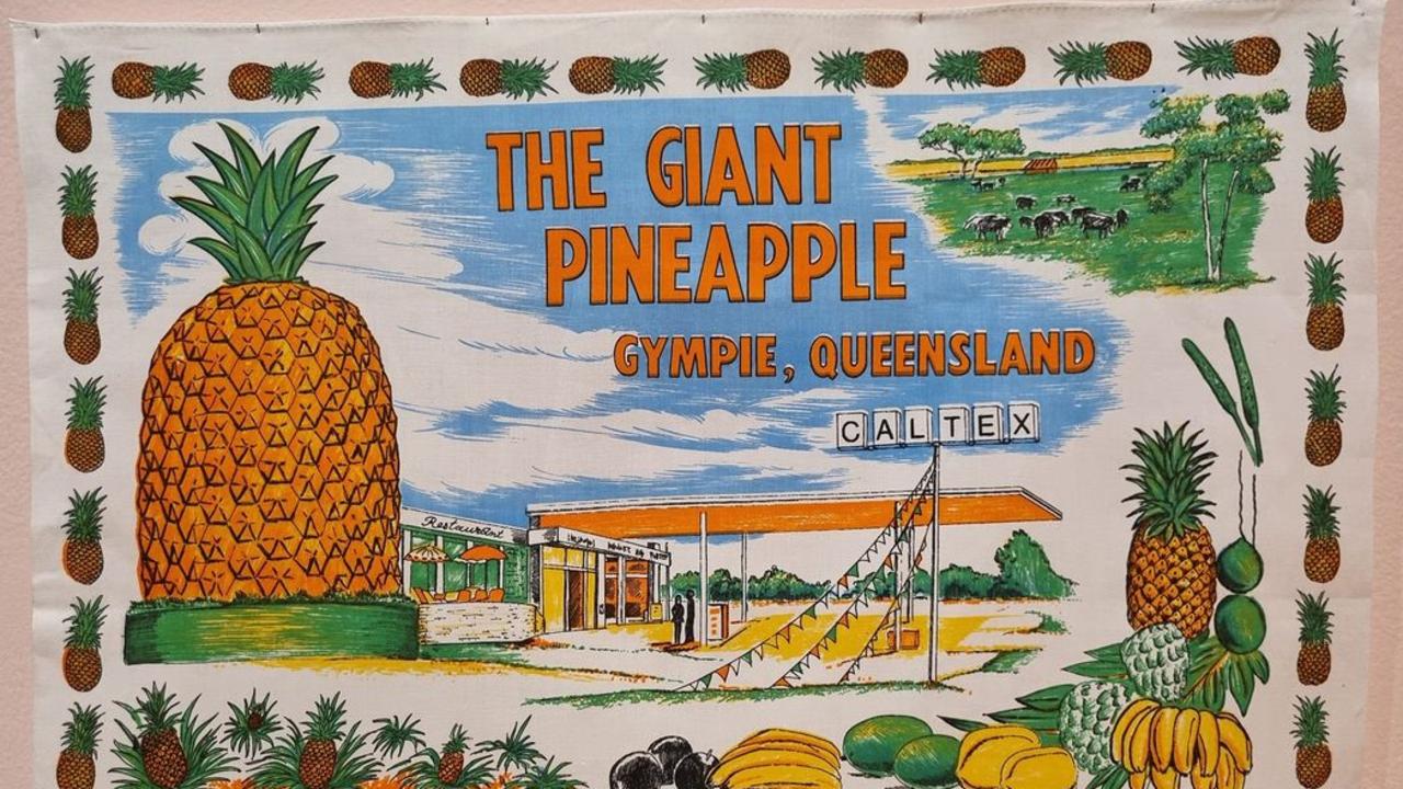 A tea towel commemorating Gympie’s pineapple was part of a Queensland tea towel exhibit running at the state library in 2022.