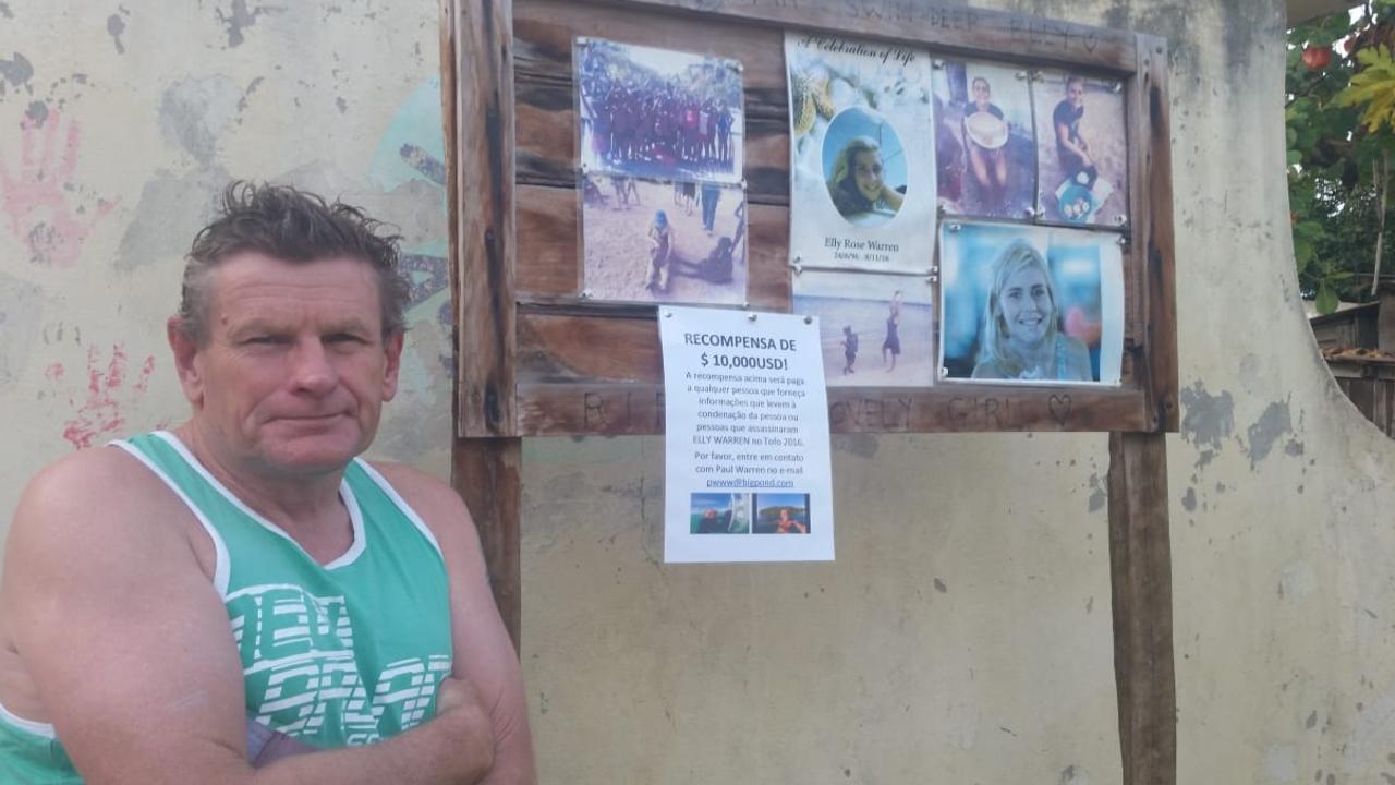 Paul Warren in Tofo, Mozambique with a photo memorial of his daughter seeking clues as to anyone who might know something of her death.