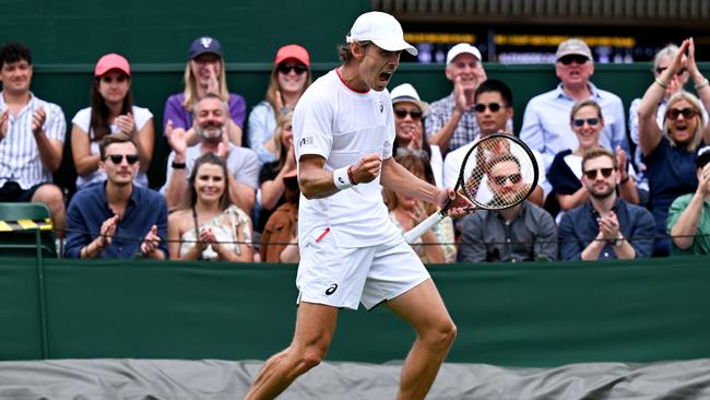 Alex de Minaur celebrates winning match point against Kimmer Coppejans of Begium in the Men's Singles first round match. Picture: Getty Images.