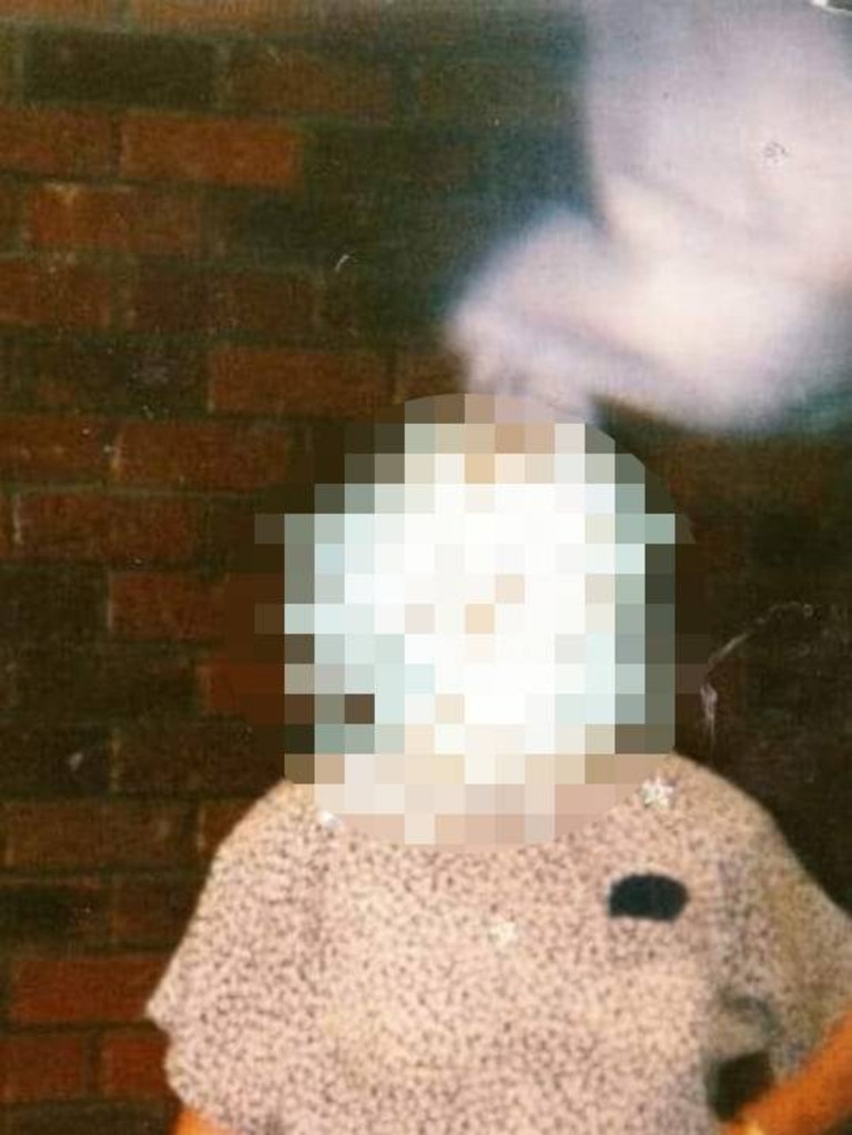 A white substance appears in a photo above one family member.