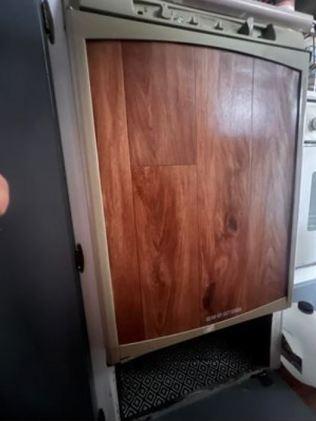 Sam was cleaning a cupboard under her fridge in an attempt to get rid of cockroaches. Picture: Supplied